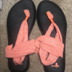 Orange/white sanuk’s